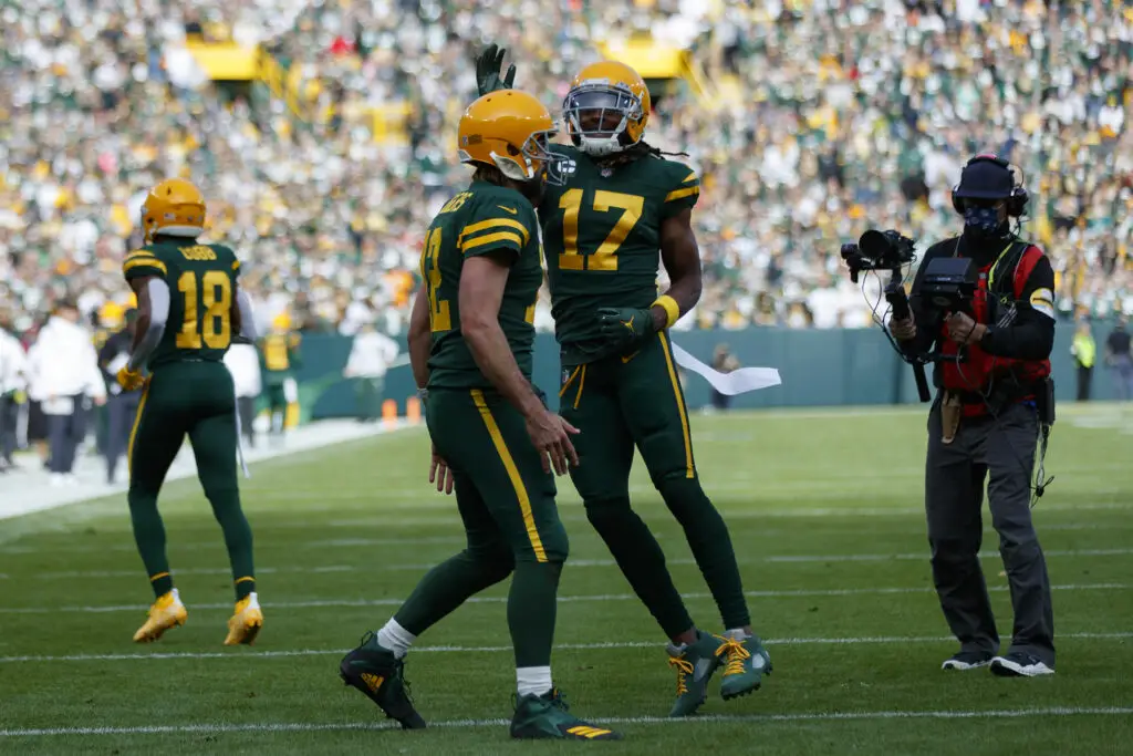 Oct 24, 2021; Green Bay, Wisconsin, USA; Green Bay Packers wide receiver Davante Adams (17) celebrates with quarterback Aaron Rodgers (12) after scoring a touchdown during the first quarter against the Washington Football Team at Lambeau Field. Mandatory Credit: Jeff Hanisch-USA TODAY Sports