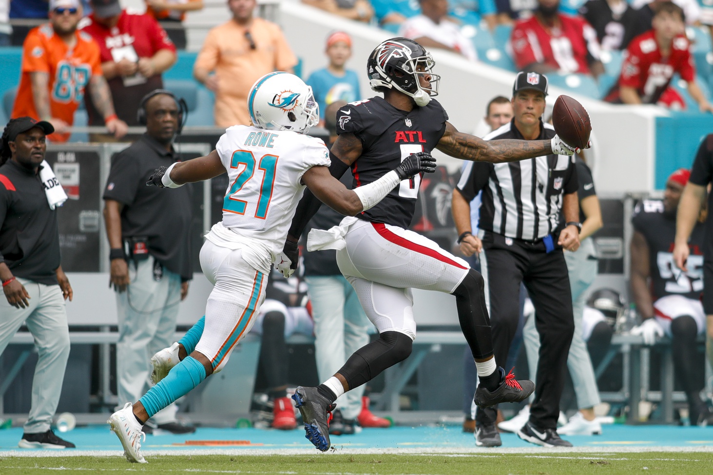 Oct 24, 2021; Miami Gardens, Florida, USA; Atlanta Falcons tight end Kyle Pitts (8) makes a one-handed catch against Miami Dolphins free safety Eric Rowe (21) during the second quarter of the game at Hard Rock Stadium. Mandatory Credit: Sam Navarro-USA TODAY Sports