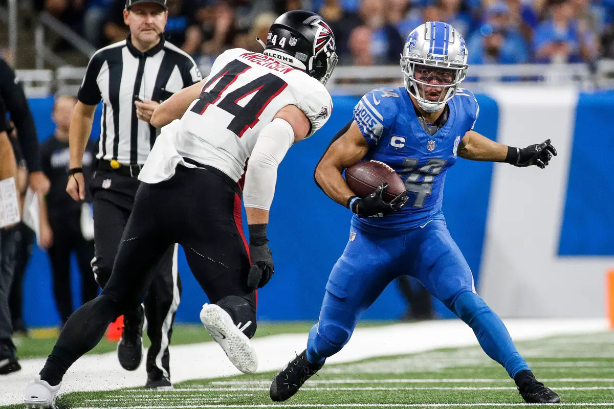 Detroit Lions wide receiver Amon-Ra St. Brown (14) runs against Atlanta Falcons linebacker Troy Andersen (44) during the second half at Ford Field in Detroit on Sunday, Sept. 24, 2023. © Junfu Han / USA TODAY NETWORK