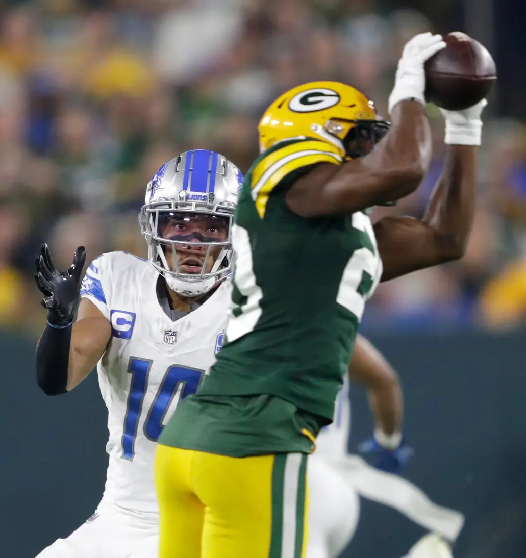 "If A White Person Said This" Lions' Amon-Ra St. Brown Sees Racist Video Leak, Fans Outraged 4 Green Bay Packers safety Rudy Ford (20) intercepts a pass intended for Detroit Lions wide receiver Amon-Ra St. Brown (14) during their football game Thursday, September 28, 2023, at Lambeau Field in Green Bay, Wis. Dan Powers/USA TODAY NETWORK-Wisconsin.