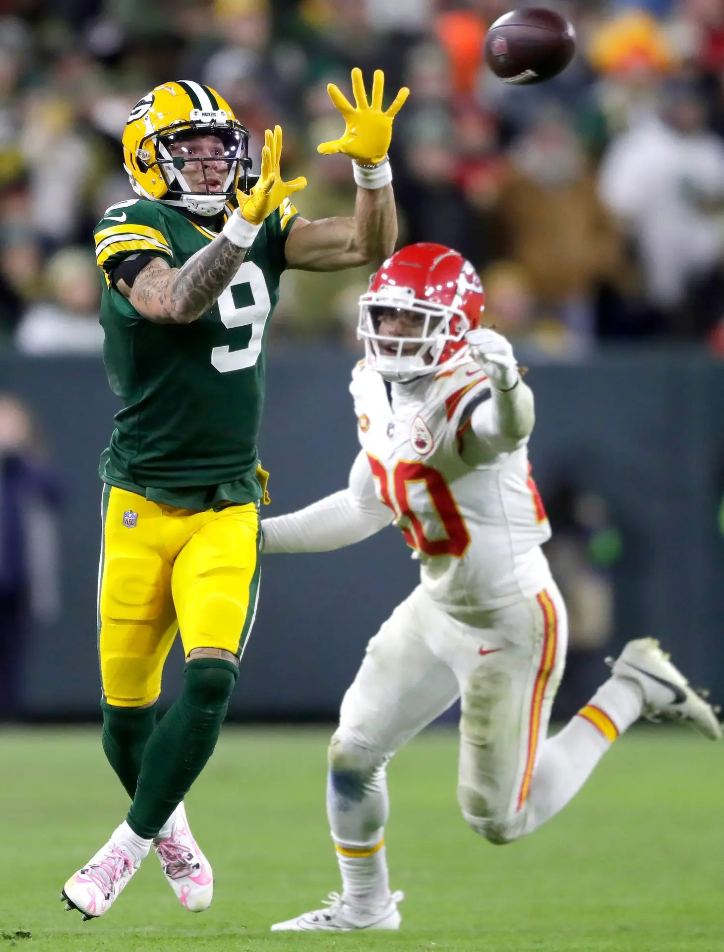 Green Bay Packers wide receiver Christian Watson (9) catches a pass against Kansas City Chiefs safety Justin Reid (20) during their football game Sunday, Dec. 3, 2023, at Lambeau Field in Green Bay, Wis. Wm. Glasheen USA TODAY NETWORK-Wisconsin