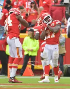 Oct 7, 2018; Kansas City, MO, USA; Kansas City Chiefs running back Kareem Hunt (27) celebrates with tight end Demetrius Harris (84) after scoring a touchdown against the Jacksonville Jaguars during the second half at Arrowhead Stadium. Mandatory Credit: Denny Medley-USA TODAY Sports