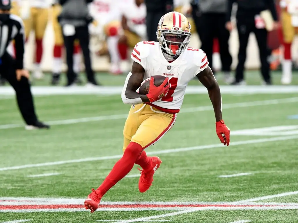 Oct 25, 2020; Foxborough, Massachusetts, USA; San Francisco 49ers wide receiver Brandon Aiyuk (11) runs with the ball against the New England Patriots during the first half at Gillette Stadium. Mandatory Credit: Brian Fluharty-USA TODAY Sports