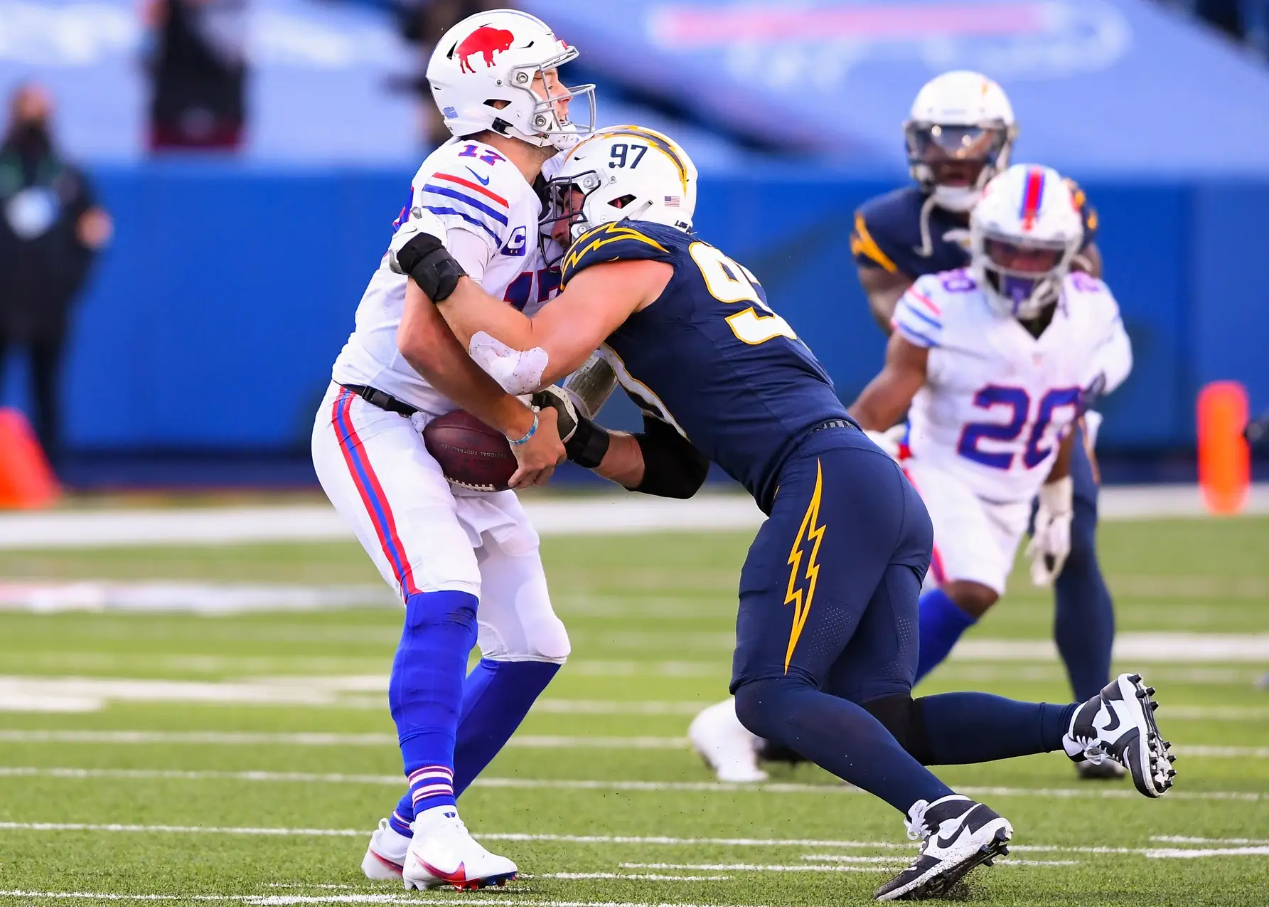 Nov 29, 2020; Orchard Park, New York, USA; Los Angeles Chargers defensive end Joey Bosa (97) sacks Buffalo Bills quarterback Josh Allen (17) during the third quarter at Bills Stadium. Mandatory Credit: Rich Barnes-USA TODAY Sports