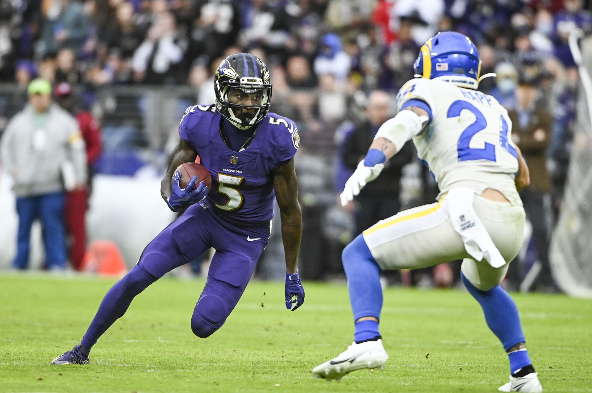 Jan 2, 2022; Baltimore, Maryland, USA; Baltimore Ravens wide receiver Marquise Brown (5) runs as Los Angeles Rams free safety Taylor Rapp (24) defends during the second half at M&T Bank Stadium. Mandatory Credit: Tommy Gilligan-USA TODAY Sports