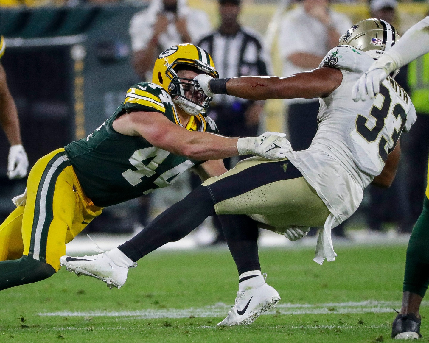 Green Bay Packers linebacker Ty Summers (44) tackles New Orleans Saints running back Abram Smith (33) during their football game on Friday, August 19, 2022, at Lambeau Field in Green Bay, Wisconsin. The Packers won the game 20-10. Tork Mason/USA TODAY NETWORK-Wisconsin (Detroit Lions)