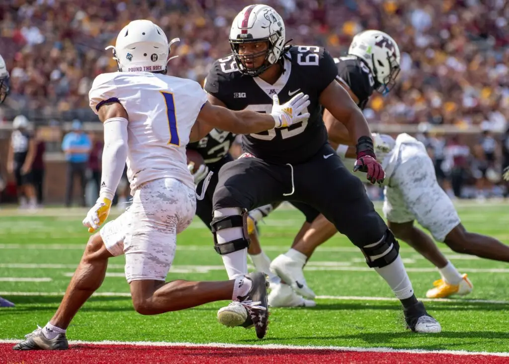 Sep 10, 2022; Minneapolis, Minnesota, USA; Minnesota Golden Gophers offensive lineman Aireontae Ersery (69) blocks Western Illinois Leathernecks defensive back JJ Ross (1) in the second quarter at Huntington Bank Stadium. Mandatory Credit: Matt Blewett-USA TODAY Sports (Kansas City Chiefs)