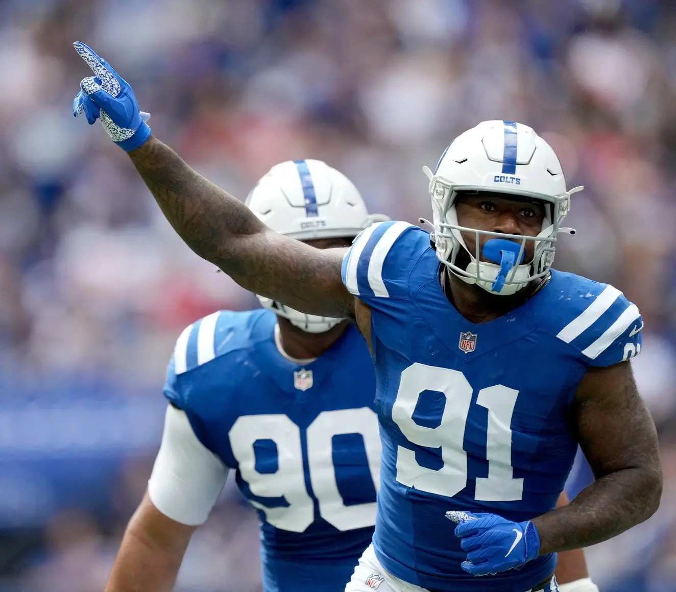 Indianapolis Colts defensive end Yannick Ngakoue (91) celebrates after sacking Kansas City Chiefs quarterback Patrick Mahomes (15) on Sunday, Sept. 25, 2022, during a game against the Kansas City Chiefs at Lucas Oil Stadium in Indianapolis. © Robert Scheer/IndyStar / USA TODAY NETWORK. (Baltimore Ravens)