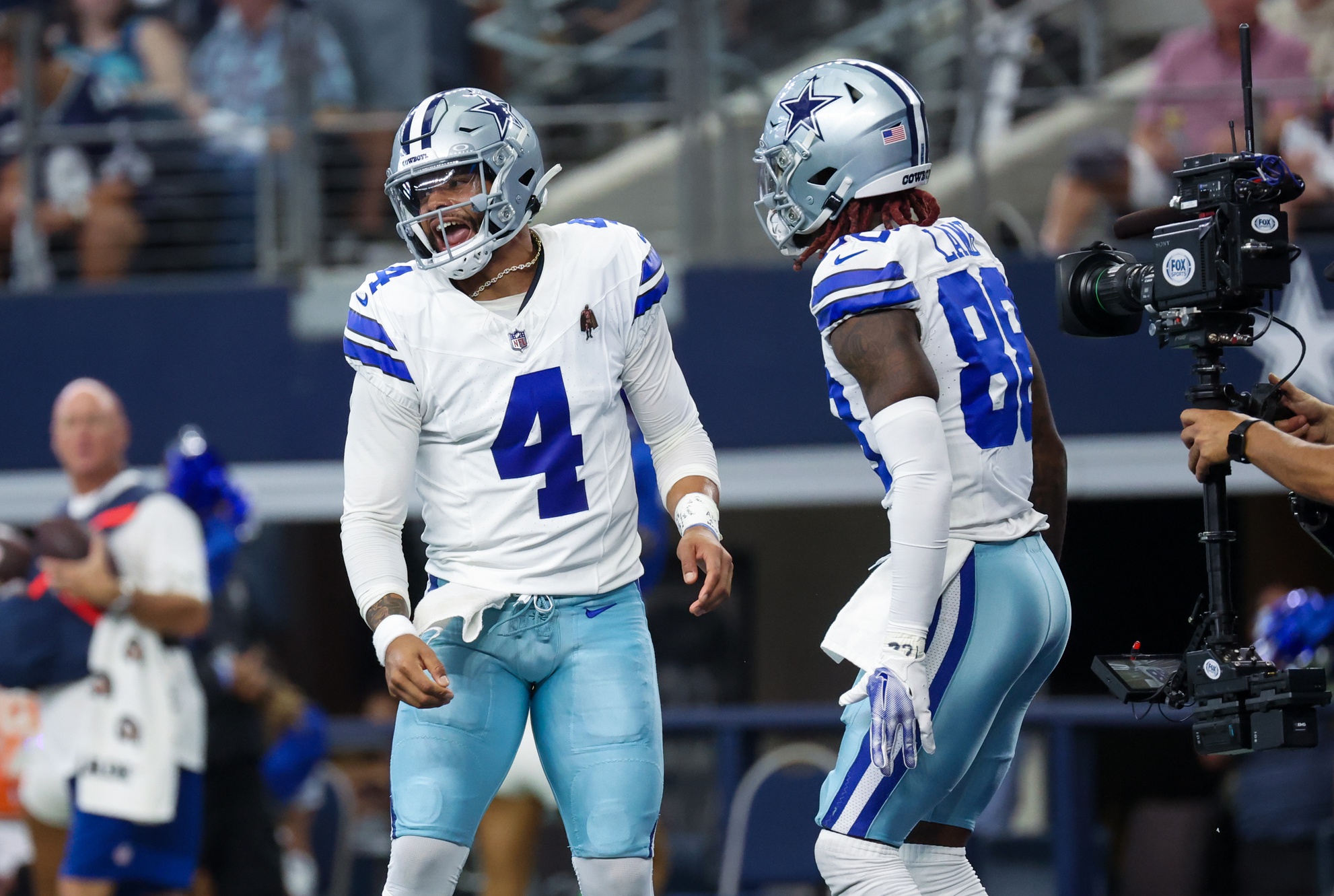 Oct 1, 2023; Arlington, Texas, USA; Dallas Cowboys quarterback Dak Prescott (4) celebrates with Dallas Cowboys wide receiver CeeDee Lamb (88) after throwing a touchdown pass during the first quarter against the New England Patriots at AT&T Stadium. Mandatory Credit: Kevin Jairaj-USA TODAY Sports