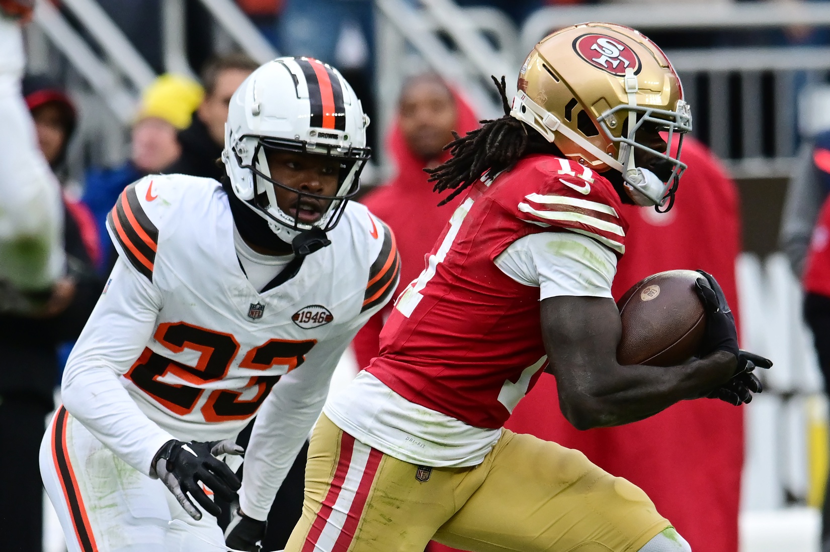 Oct 15, 2023; Cleveland, Ohio, USA; San Francisco 49ers wide receiver Brandon Aiyuk (11) runs with the ball after a catch as Cleveland Browns cornerback Martin Emerson Jr. (23) defends during the second half at Cleveland Browns Stadium. Mandatory Credit: Ken Blaze-USA TODAY Sports