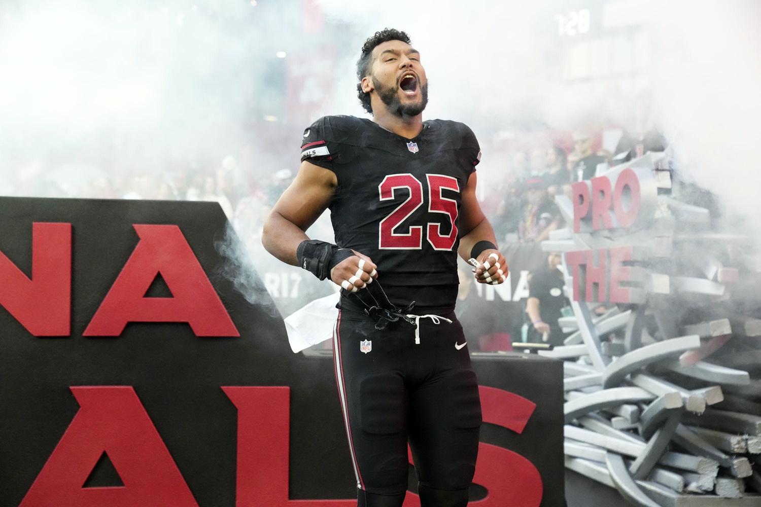 Arizona Cardinals linebacker Zaven Collins (25) during player introductions before facing the Los Angeles Rams at State Farm Stadium in Glendale on Nov. 26, 2023. © Rob Schumacher/The Republic / USA TODAY NETWORK