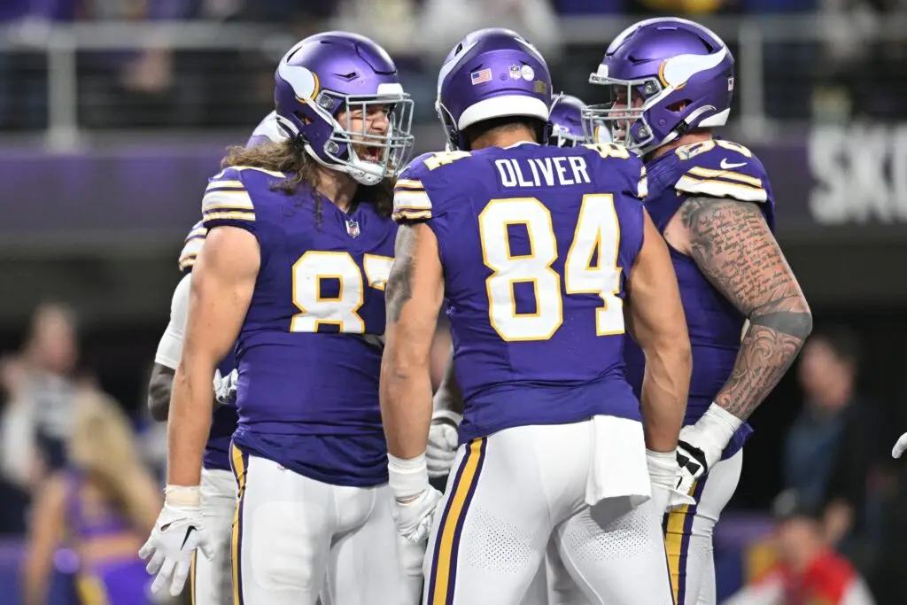 Nov 27, 2023; Minneapolis, Minnesota, USA; Minnesota Vikings tight end T.J. Hockenson (87) reacts with tight end Josh Oliver (84) and guard Dalton Risner (66) after a touchdown against the Chicago Bears during the fourth quarter at U.S. Bank Stadium. Mandatory Credit: Jeffrey Becker-USA TODAY Sports