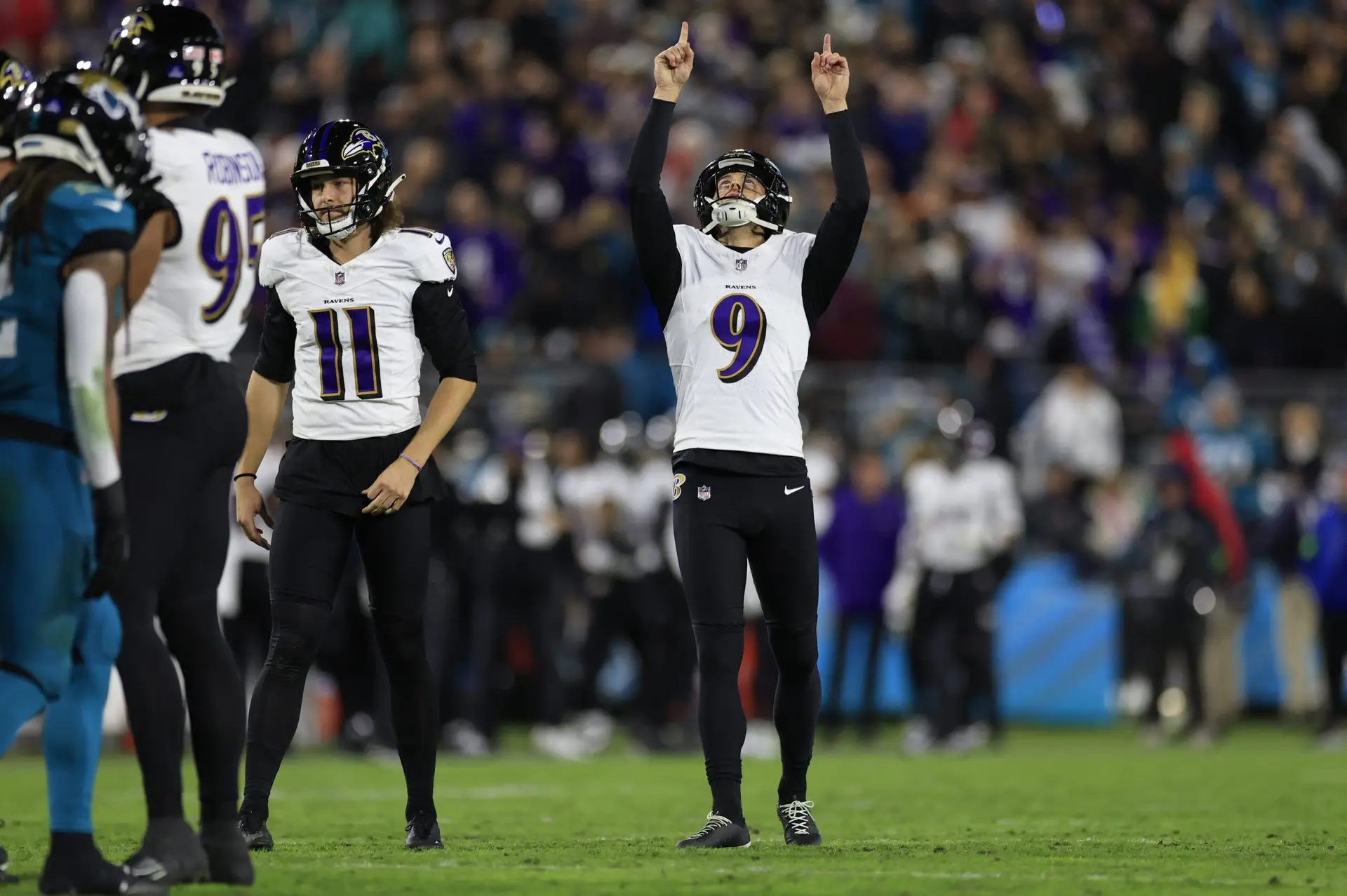 Baltimore Ravens place kicker Justin Tucker (9) points skyward after making a point after try during the fourth quarter of a regular season NFL football matchup Sunday, Dec. 17, 2023 at EverBank Stadium in Jacksonville, Fla. The Baltimore Ravens defeated the Jacksonville Jaguars 23-7. [Corey Perrine/Florida Times-Union]