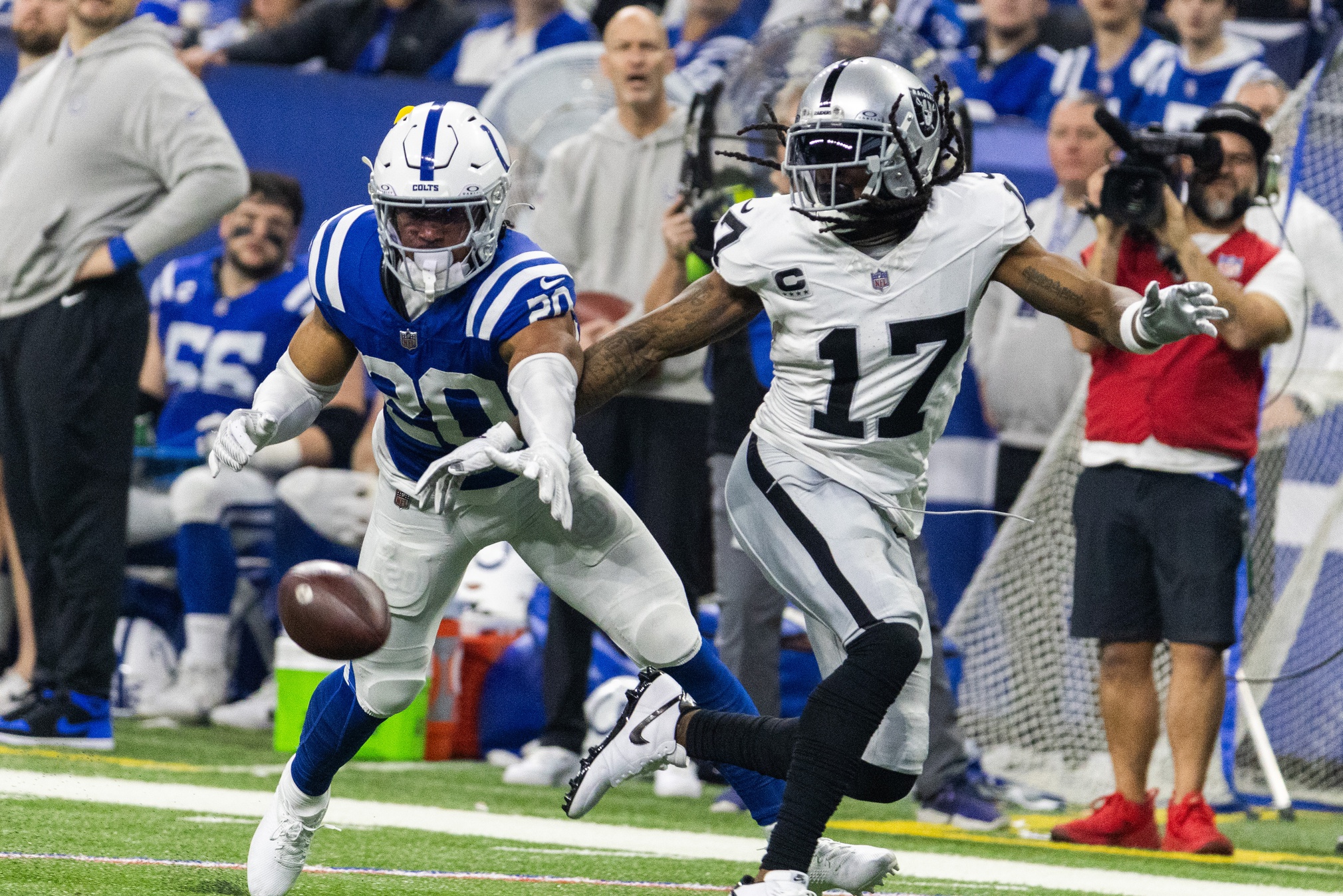 Dec 31, 2023; Indianapolis, Indiana, USA; Indianapolis Colts safety Nick Cross (20) defends Las Vegas Raiders wide receiver Davante Adams (17) in the first half at Lucas Oil Stadium. Mandatory Credit: Trevor Ruszkowski-USA TODAY Sports