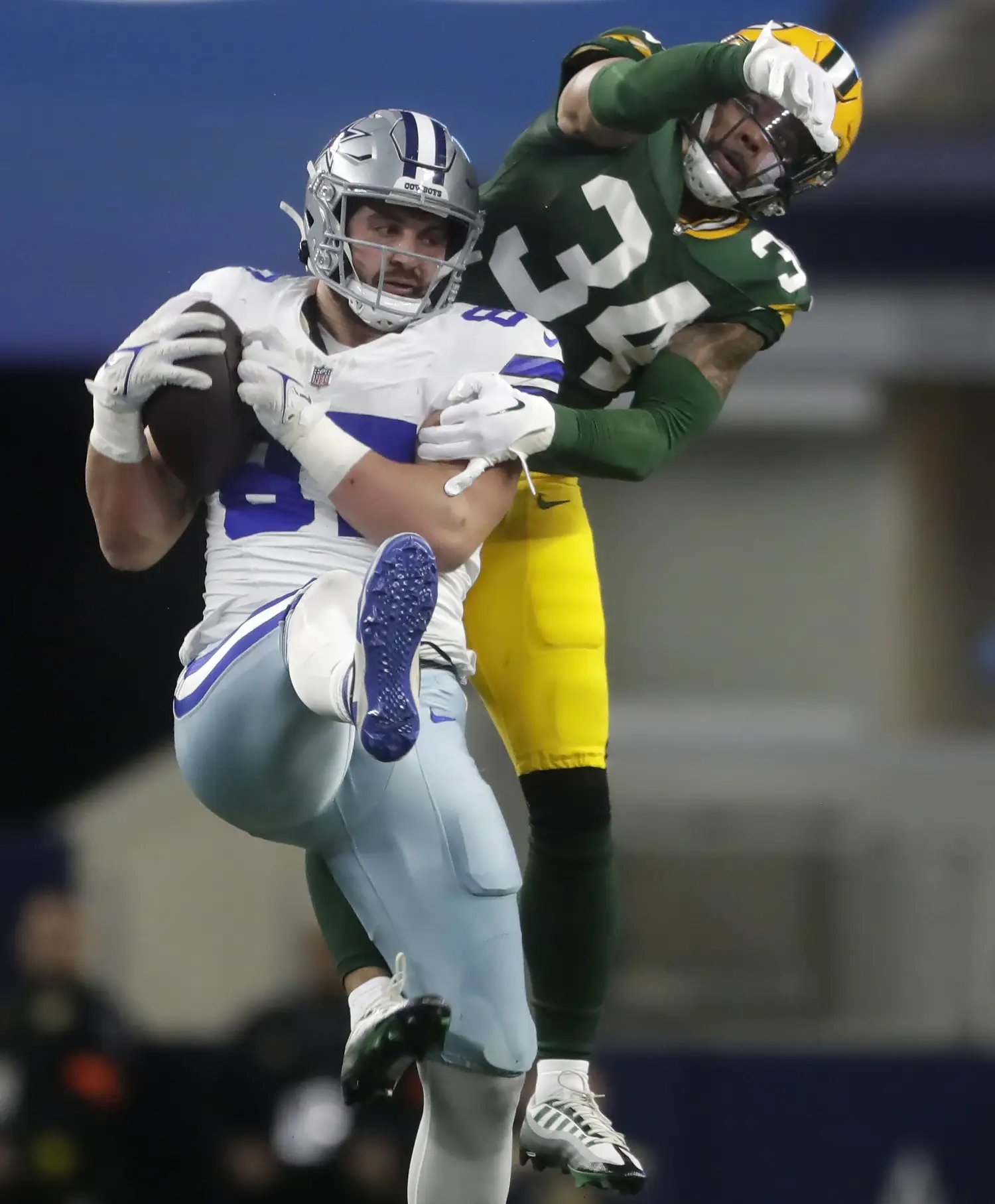 Jan 14, 2024; Arlington, Texas, USA; Dallas Cowboys tight end Jake Ferguson (87) catches a pass in front of Green Bay Packers safety Jonathan Owens (34) during the second quarter in a 2024 NFC wild card game at AT&T Stadium. Mandatory Credit: Wm. Glasheen-USA TODAY Sports