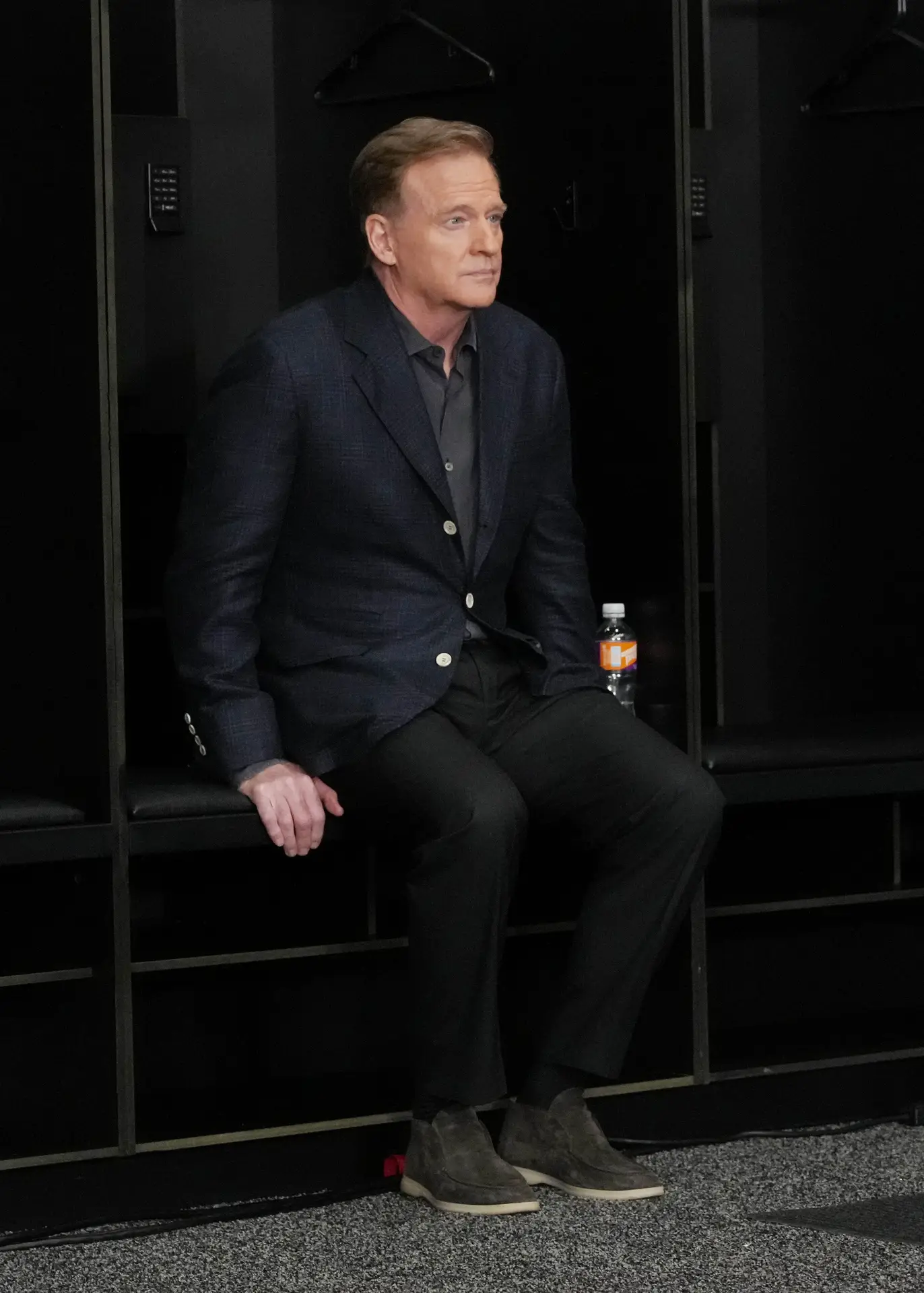 Feb 5, 2024; Las Vegas, NV, USA; NFL commissioner Roger Goodell sits in a Las Vegas Raiders stall before speaking at a press conference in advance of Super Bowl LVIII between the Kansas City Chiefs and San Francisco 49ers at Allegiant Stadium. Mandatory Credit: Kirby Lee-USA TODAY Sports