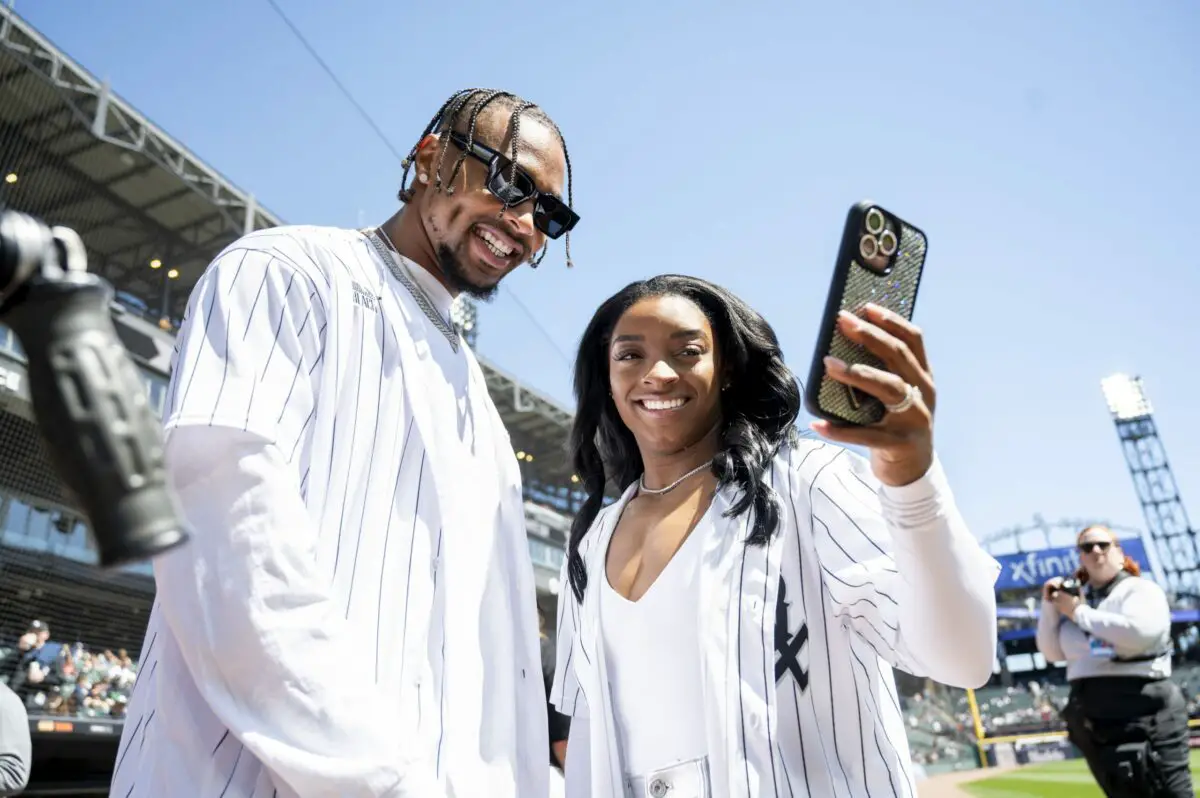 Apr 13, 2024; Chicago, Illinois, USA; Chicago Bears safety Jonathan Owens and American gymnast Simone Biles take a selfie prior to a game between the Chicago White Sox and the Cincinnati Reds at Guaranteed Rate Field. Mandatory Credit: Patrick Gorski-USA TODAY Sports