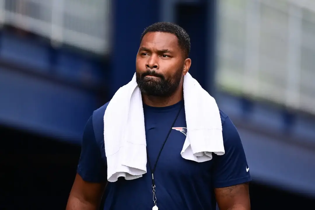 Jul 24, 2024; Foxborough, MA, USA; New England Patriots head coach Jerod Mayo walks to the podium for a press conference before training camp at Gillette Stadium. Mandatory Credit: Eric Canha-USA TODAY Sports