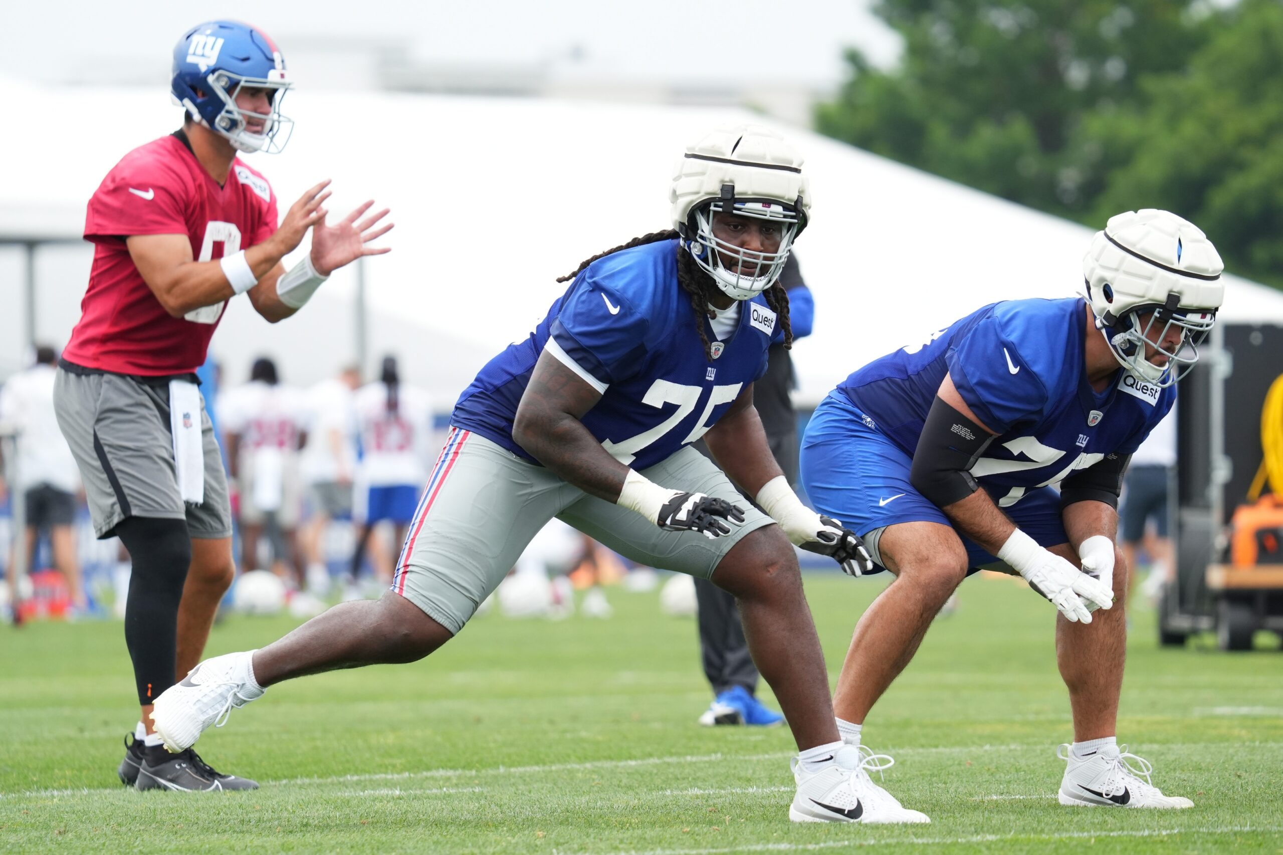 Jul 25, 2024; East Rutherford, NY, USA; New York Giants offensive tackle Joshua Ezeudu (75) participates in a drill during training camp at Quest Diagnostics Training Center. Mandatory Credit: Lucas Boland-USA TODAY Sports