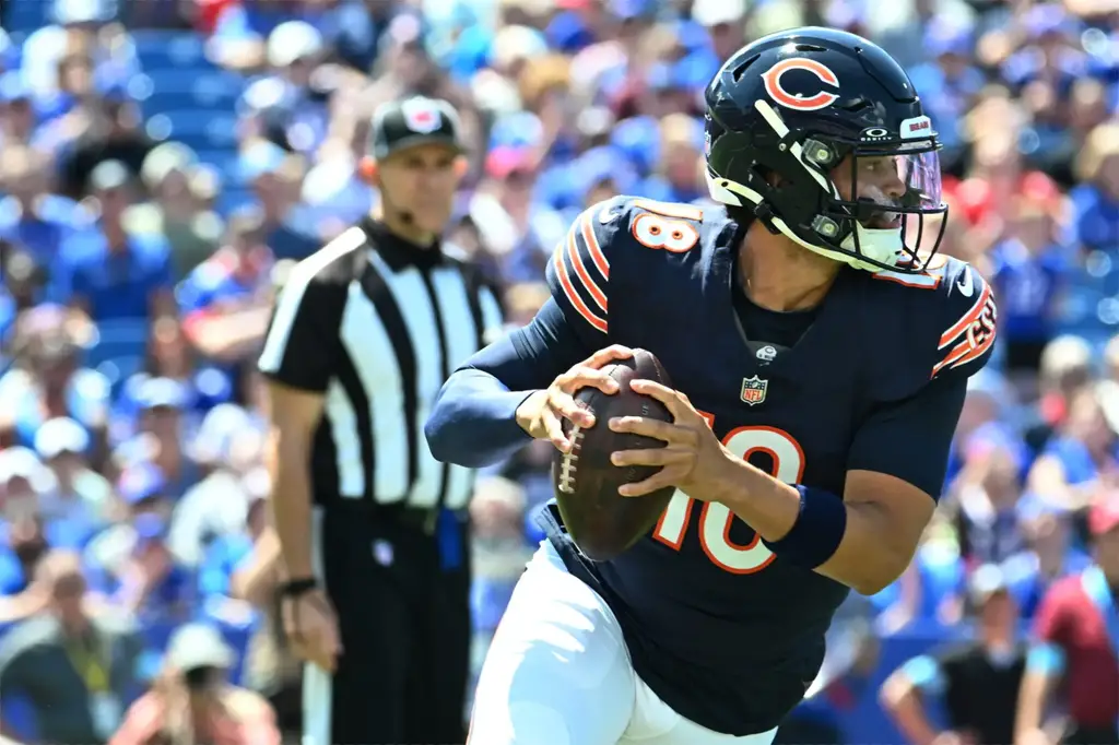 Aug 10, 2024; Orchard Park, New York, USA; Chicago Bears quarterback Caleb Williams (18) runs out of the pocket in the first quarter of a pre-season game against the Buffalo Bills at Highmark Stadium. Mandatory Credit: Mark Konezny-USA TODAY Sports