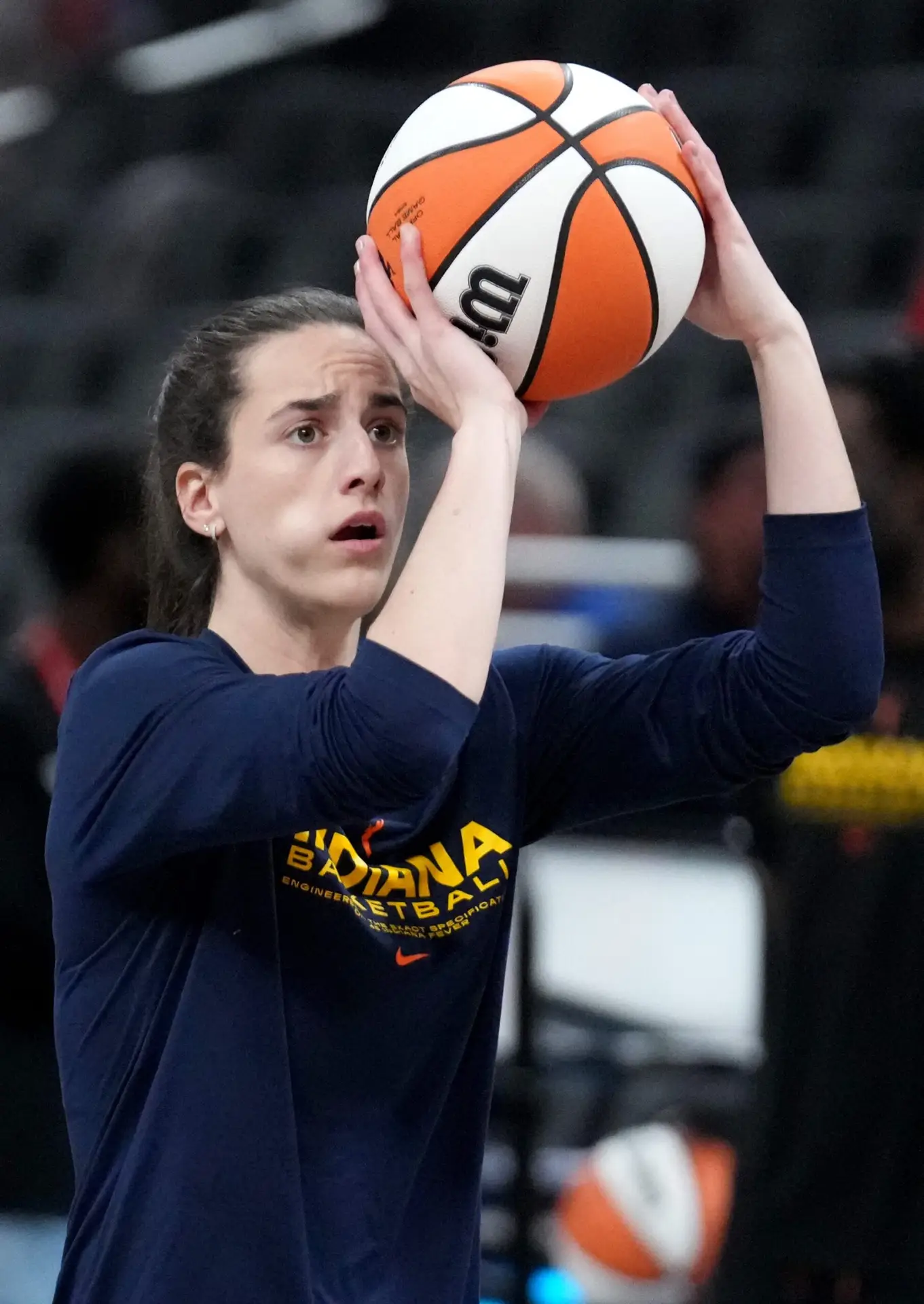 Indiana Fever guard Caitlin Clark (22) warms up before a game against the Seattle Storm on Sunday, Aug. 18, 2024, at Gainbridge Fieldhouse in Indianapolis.