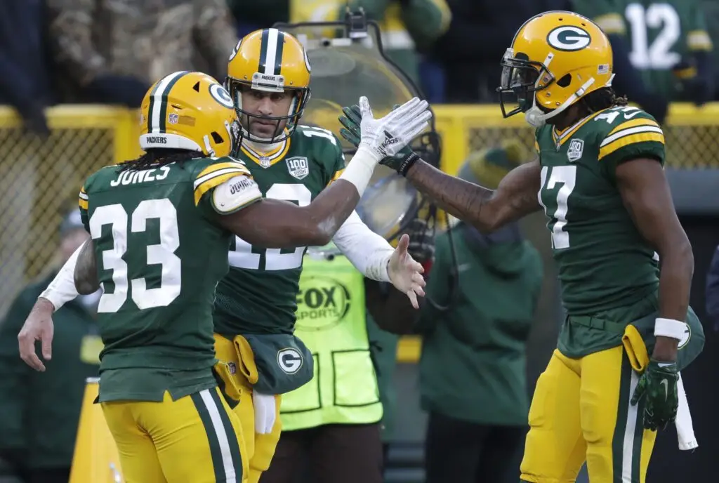 Green Bay Packers running back Aaron Jones (33) celebrates scoring a touchdown with quarterback Aaron Rodgers (12) and wide receiver Davante Adams (17) against the Atlanta Falcons Sunday, December 9, 2018, at Lambeau Field in Green Bay, Wis. Dan Powers/USA TODAY NETWORK-Wisconsin Apc Packvsfalcons 120918 1061 Djp