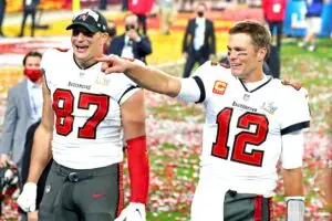 NFL Feb 7, 2021; Tampa, FL, USA; Tampa Bay Buccaneers quarterback Tom Brady (12) and tight end Rob Gronkowski (87) celebrate after beating the Kansas City Chiefs in Super Bowl LV at Raymond James Stadium. Mandatory Credit: Mark J. Rebilas-Imagn Images (Patriots)