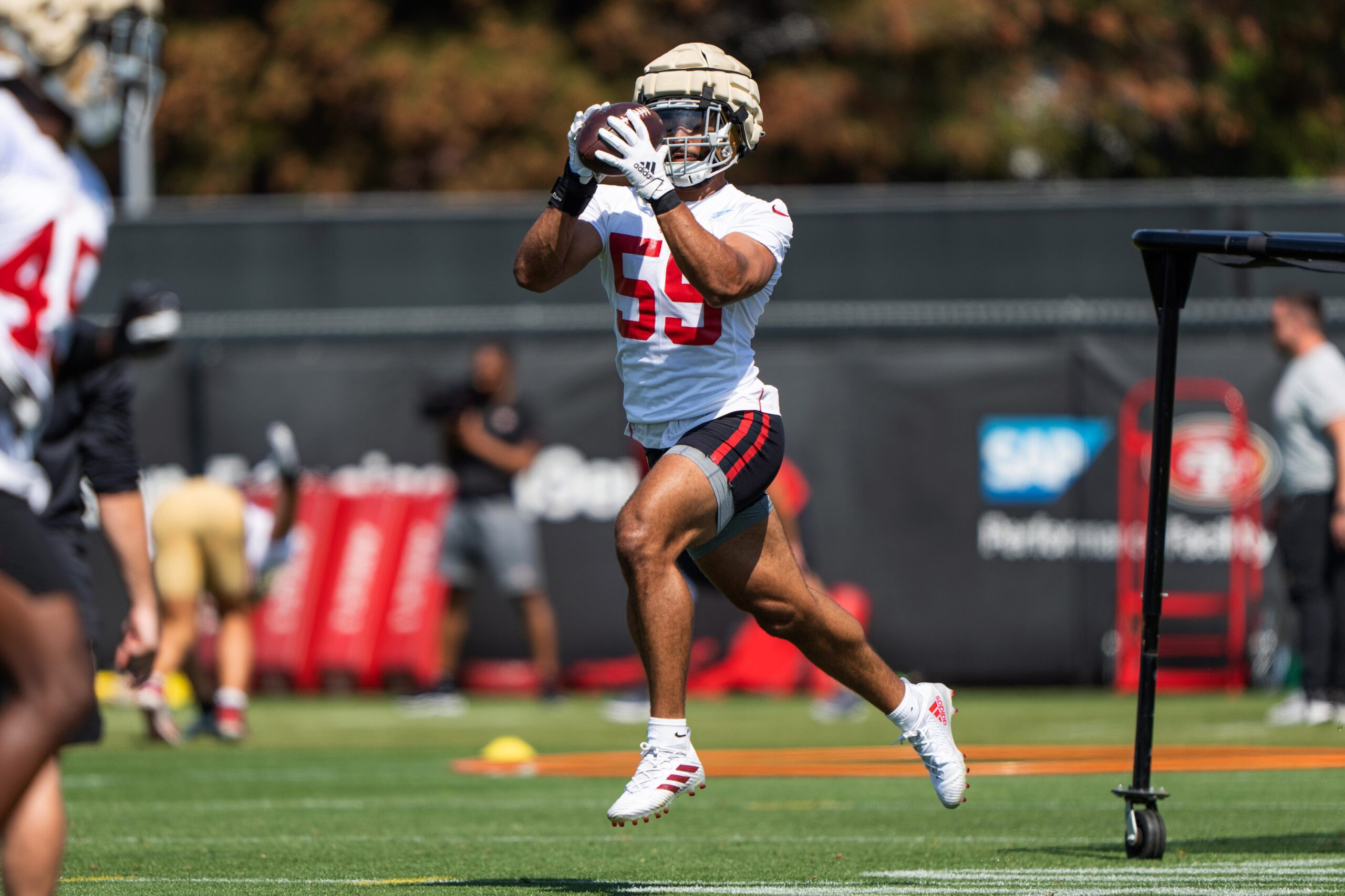 Jul 28, 2022; Santa Clara, CA, USA; San Francisco 49ers linebacker Curtis Robinson (59) makes a catch during training camp at the SAP Performance Facility near Levi Stadium. Mandatory Credit: Stan Szeto-Imagn Images