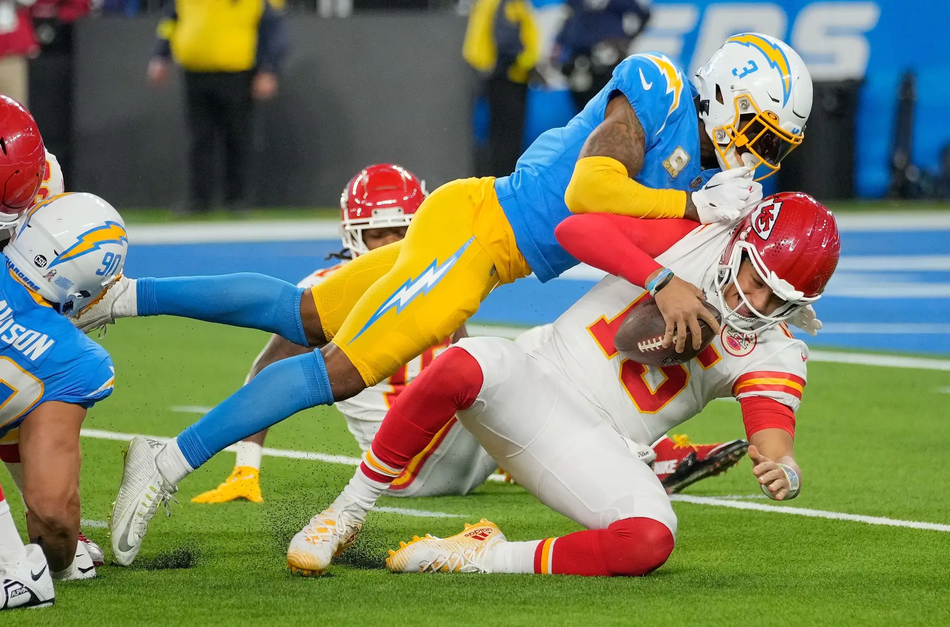 Nov 20, 2022; Inglewood, California, USA; Los Angeles Chargers safety Derwin James Jr. (3) sacks Kansas City Chiefs quarterback Patrick Mahomes (15) during the third quarter at SoFi Stadium. Mandatory Credit: Robert Hanashiro-Imagn Images