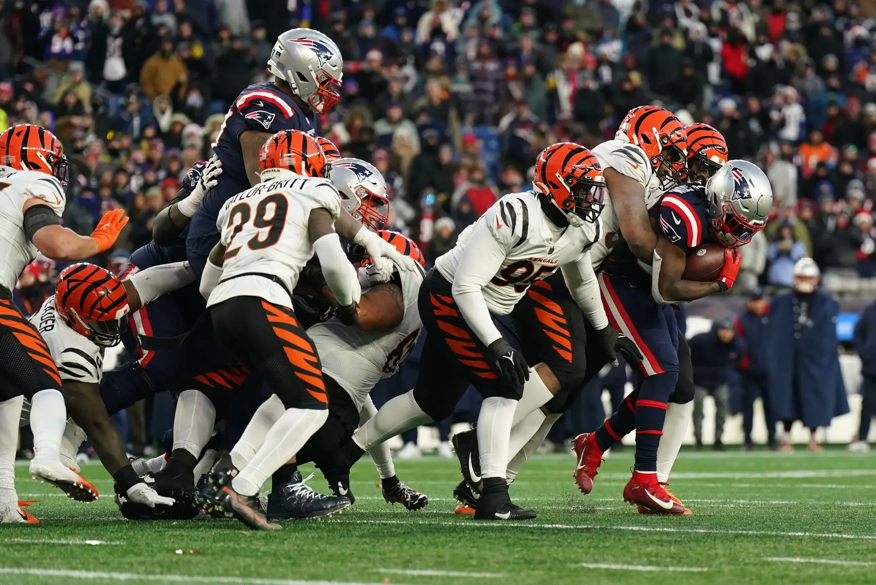 Dec 24, 2022; Foxborough, Massachusetts, USA; New England Patriots running back Rhamondre Stevenson (38) runs the ball against the Cincinnati Bengals in the fourth quarter at Gillette Stadium. Mandatory Credit: David Butler II-USA TODAY Sports