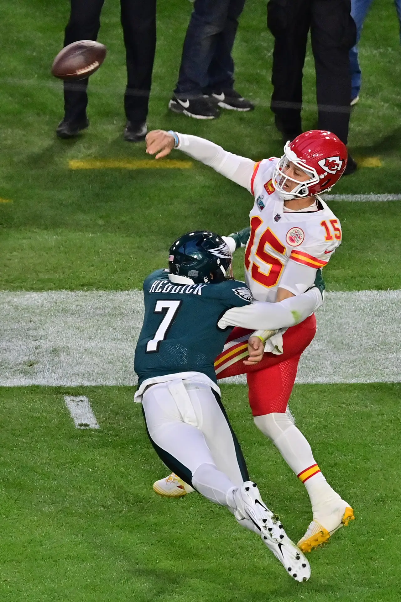 Feb 12, 2023; Glendale, Arizona, US; Kansas City Chiefs quarterback Patrick Mahomes (15) throws the ball against Philadelphia Eagles linebacker Haason Reddick (7)during the second quarter of Super Bowl LVII at State Farm Stadium. Mandatory Credit: Matt Kartozian-USA TODAY Sports (Lions)