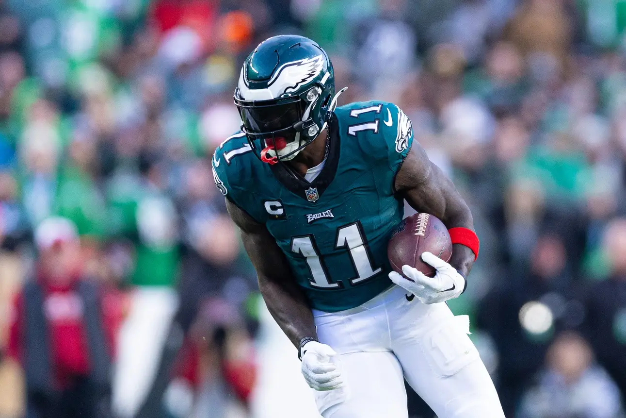 Dec 31, 2023; Philadelphia, Pennsylvania, USA; Philadelphia Eagles wide receiver A.J. Brown (11) runs with the ball during the fourth quarter against the Arizona Cardinals at Lincoln Financial Field. Mandatory Credit: Bill Streicher-Imagn Images