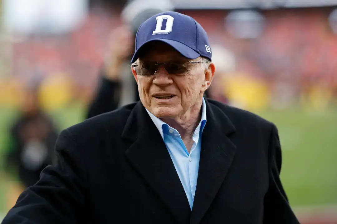 Jan 7, 2024; Landover, Maryland, USA; Dallas Cowboys owner Jerry Jones walks off the field after warmups prior to the game against the Washington Commanders at FedExField. Mandatory Credit: Geoff Burke-Imagn Images