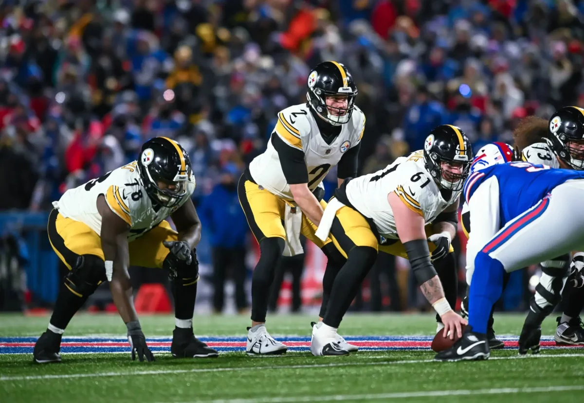 Jan 15, 2024; Orchard Park, New York, USA; Pittsburgh Steelers quarterback Mason Rudolph (2) at the line of scrimmage with center Mason Cole (61) and guard James Daniels (78) against the Buffalo Bills in the third quarter of a 2024 AFC wild card game at Highmark Stadium. Mandatory Credit: Mark Konezny-Imagn Images