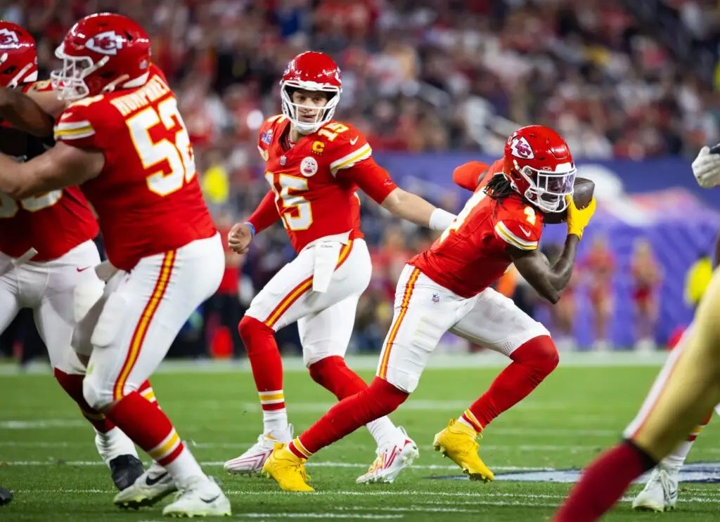 Kansas City Chiefs quarterback Patrick Mahomes (15) hands off the ball to wide receiver Rashee Rice (4) against the San Francisco 49ers during Super Bowl LVIII