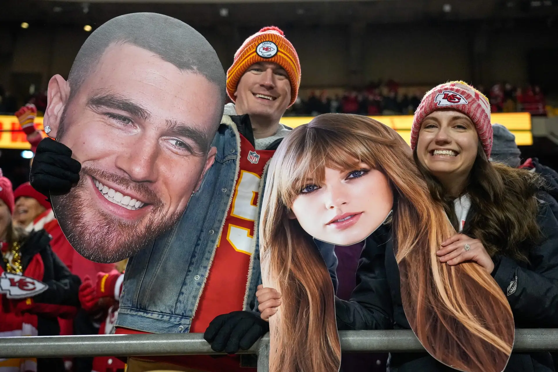 Dec. 31, 2023: Fans wave big heads of Travis Kelce and Taylor Swift during the Kansas City Chiefs' game against the Cincinnati Bengals at Arrowhead Stadium. © Sam Greene / USA TODAY NETWORK