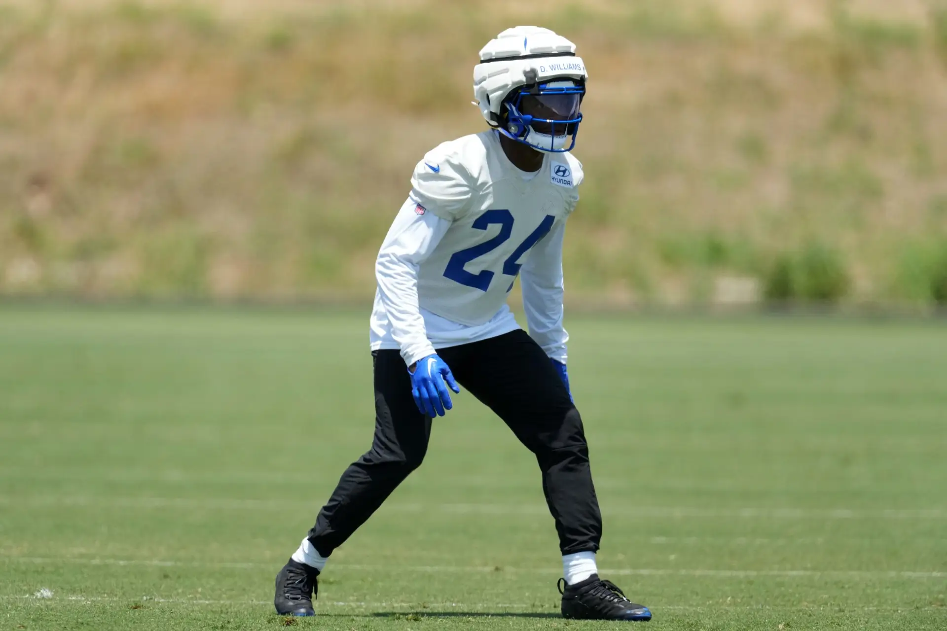 May 21, 2024, Thousand Oaks, California, USA; Los Angeles Rams defensive back Darious Williams (24) wears a Guardian helmet cap during organized team activities at Cal Lutheran University. Mandatory Credit: Kirby Lee-Imagn Images