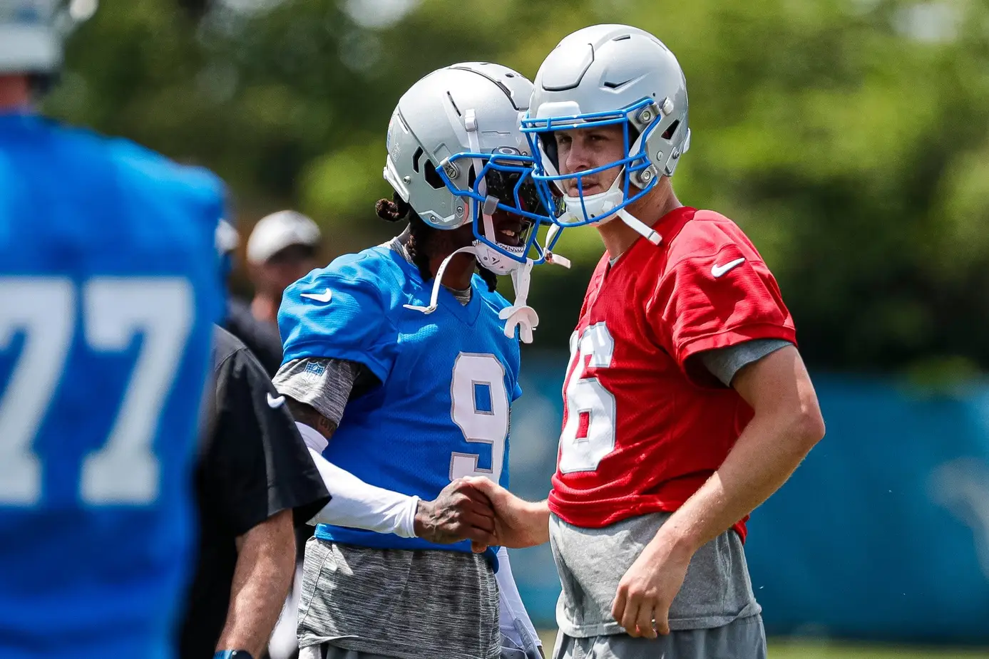 Detroit Lions wide receiver Jameson Williams (9) shakes hands with quarterback Jared Goff (16) at practice during mini camp at Detroit Lions headquarters and practice facility in Allen Park on Tuesday, June 4, 2024. © Junfu Han / USA TODAY NETWORK