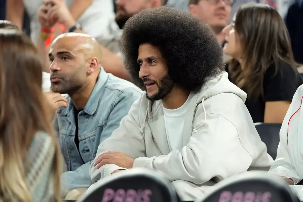 Aug 8, 2024; Paris, France; Former NFL player Colin Kaepernick looks on during the first half between the United States and Serbia in a men's basketball semifinal game during the Paris 2024 Olympic Summer Games at Accor Arena. Mandatory Credit: Kyle Terada-Imagn Images