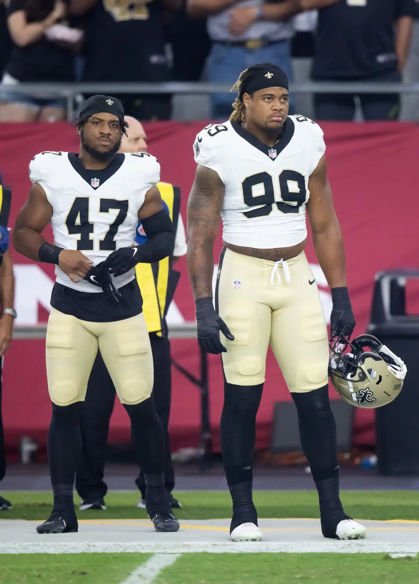 Aug 10, 2024; Glendale, Arizona, USA; New Orleans Saints linebacker Khaleke Hudson (47) and defensive end Chase Young (99) against the Arizona Cardinals during a preseason NFL game at State Farm Stadium. Mandatory Credit: Mark J. Rebilas-USA TODAY Sports