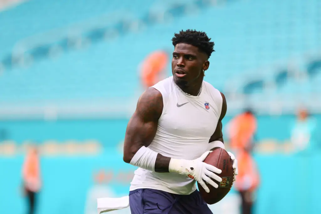 Aug 17, 2024; Miami Gardens, Florida, USA; Miami Dolphins wide receiver Tyreek Hill (10) throws the football before preseason game against the Washington Commanders at Hard Rock Stadium. Mandatory Credit: Sam Navarro-USA TODAY Sports