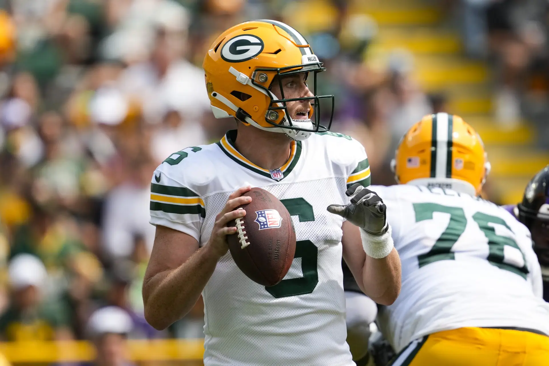 Aug 24, 2024; Green Bay, Wisconsin, USA; Green Bay Packers quarterback Sean Clifford (6) looks to throw a pass during the second quarter against the Baltimore Ravens at Lambeau Field. Mandatory Credit: Jeff Hanisch-Imagn Images