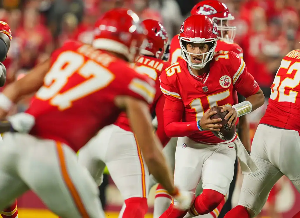 Sep 5, 2024; Kansas City, Missouri, USA; Kansas City Chiefs starting quarterback Patrick Mahomes (15) scrambles during the first half against the Baltimore Ravens at GEHA Field at Arrowhead Stadium. Mandatory Credit: Jay Biggerstaff-Imagn Images