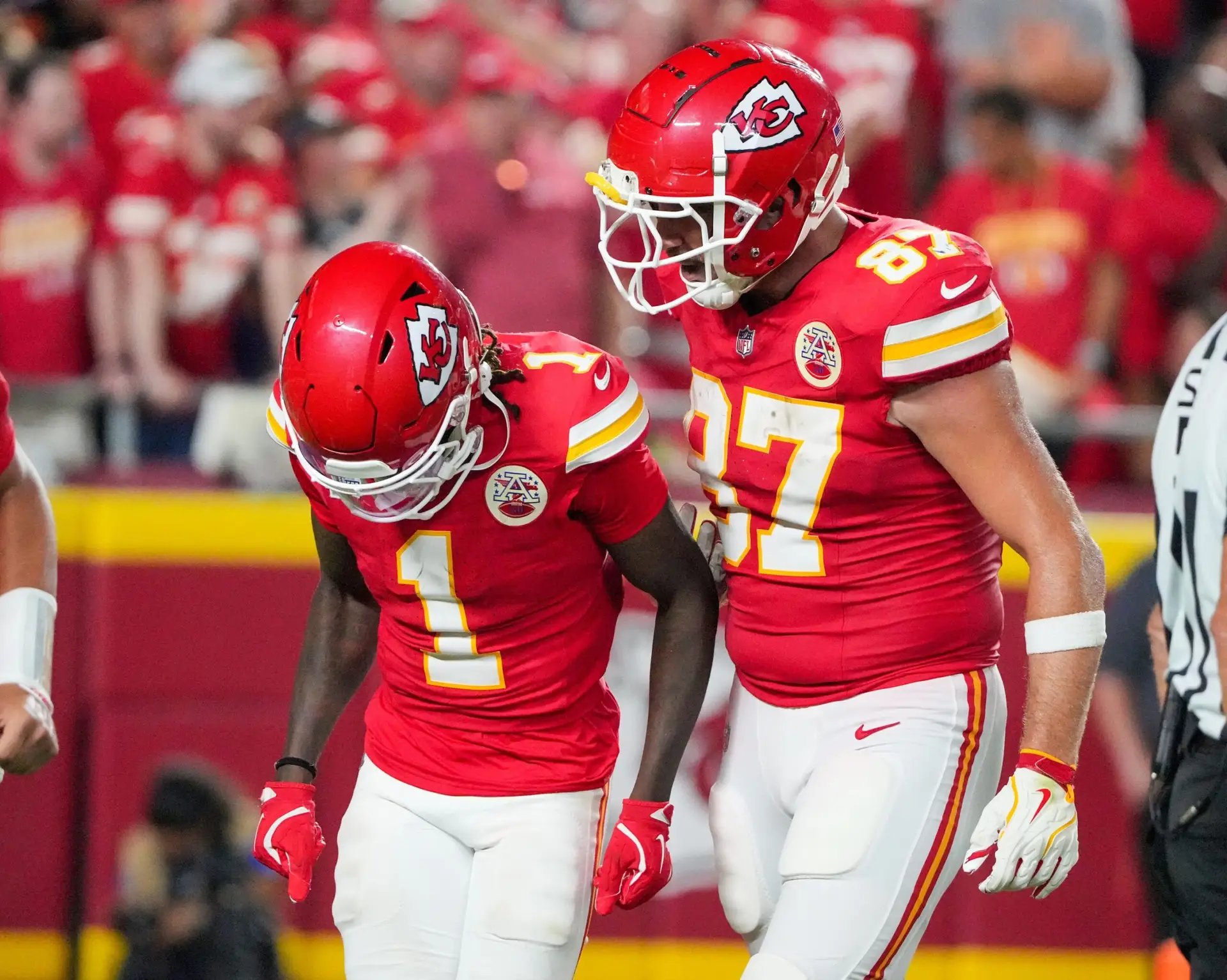 Sep 5, 2024; Kansas City, Missouri, USA; Kansas City Chiefs tight end Travis Kelce (87) celebrates with wide receiver Xavier Worthy (1) after a touchdown agains the Baltimore Ravens during the second half at GEHA Field at Arrowhead Stadium. Mandatory Credit: Denny Medley-Imagn Images