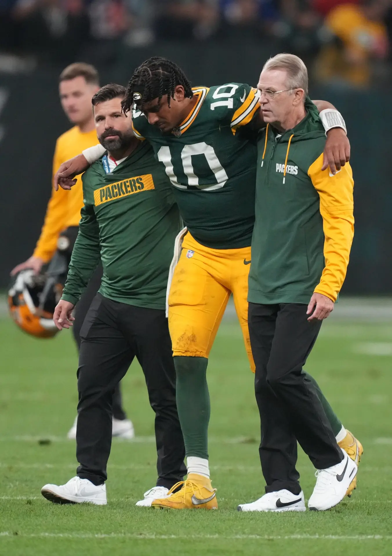 Sep 6, 2024; Sao Paulo, BRA; Green Bay Packers quarterback Jordan Love (10) is assisted off the field after an injury during the second half against the Philadelphia Eagles at Neo Quimica Arena. Mandatory Credit: Kirby Lee-Imagn Images