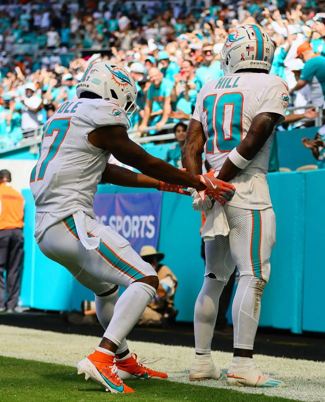 Sep 8, 2024; Miami Gardens, Florida, USA; Miami Dolphins wide receiver Tyreek Hill (10) celebrates with wide receiver Jaylen Waddle (17) after scoring a touchdown against the Jacksonville Jaguars during the third quarter at Hard Rock Stadium. Mandatory Credit: Sam Navarro-Imagn Images