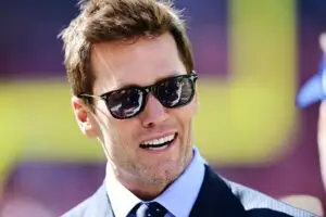 Sep 8, 2024; Cleveland, Ohio, USA; Fox Sports broadcaster Tom Brady talks on the field before the game between the Cleveland Browns and the Dallas Cowboys at Huntington Bank Field. Mandatory Credit: Ken Blaze-Imagn Images