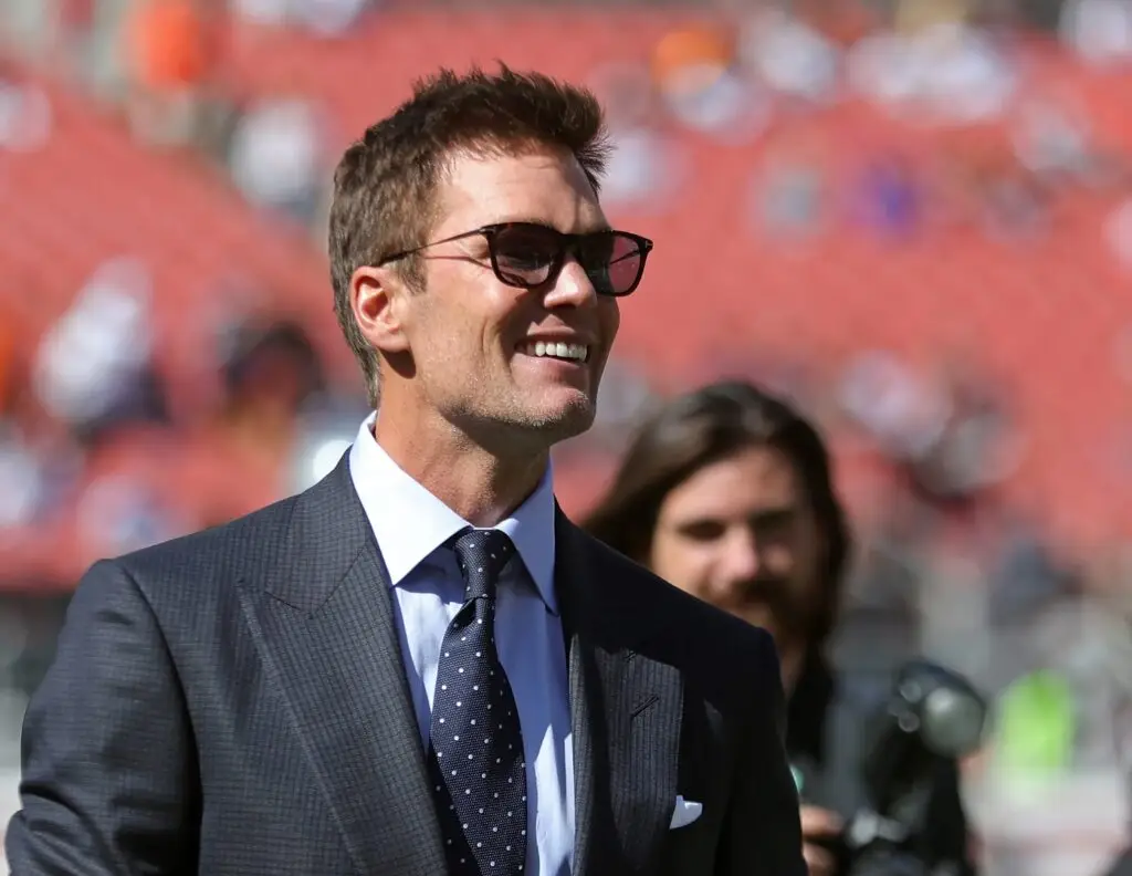 NFL legend Tom Brady is all smiles before an NFL football game at Huntington Bank Field, Sunday, Sept. 8, 2024, in Cleveland, Ohio. © Jeff Lange / USA TODAY NETWORK