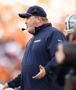 Sep 8, 2024; Cleveland, Ohio, USA; Dallas Cowboys head coach Mike McCarthy argues with line judge Julian Mapp (10) during the third quarter against the Cleveland Browns at Huntington Bank Field. Mandatory Credit: Scott Galvin-Imagn Images