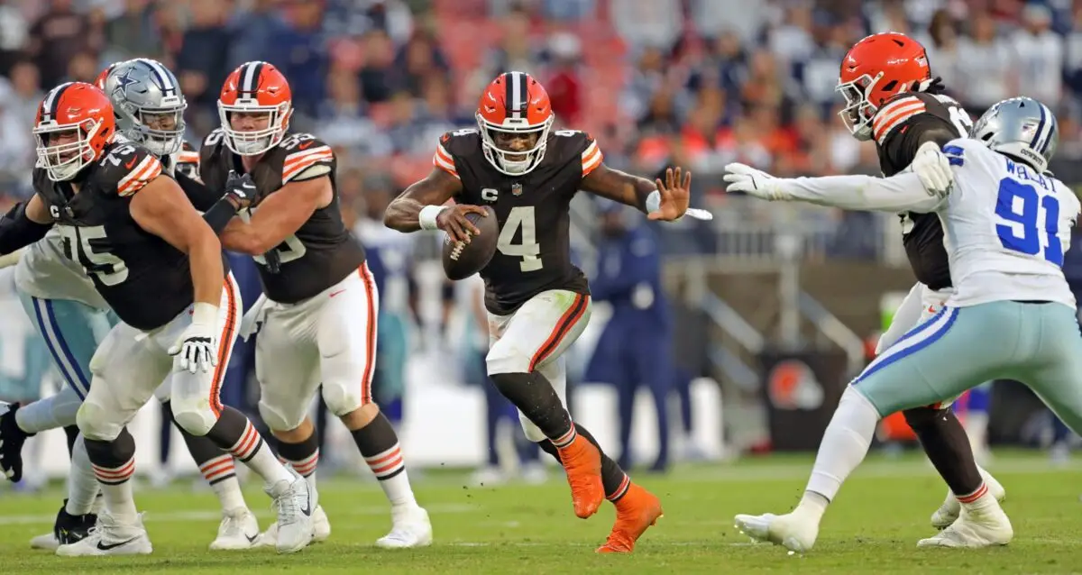 Cleveland Browns quarterback Deshaun Watson (4) runs for yards through the hole created by guard Joel Bitonio, left, center Ethan Pocic (55) and offensive tackle James Hudson III during the second half of an NFL football game at Huntington Bank Field, Sunday, Sept. 8, 2024, in Cleveland, Ohio.